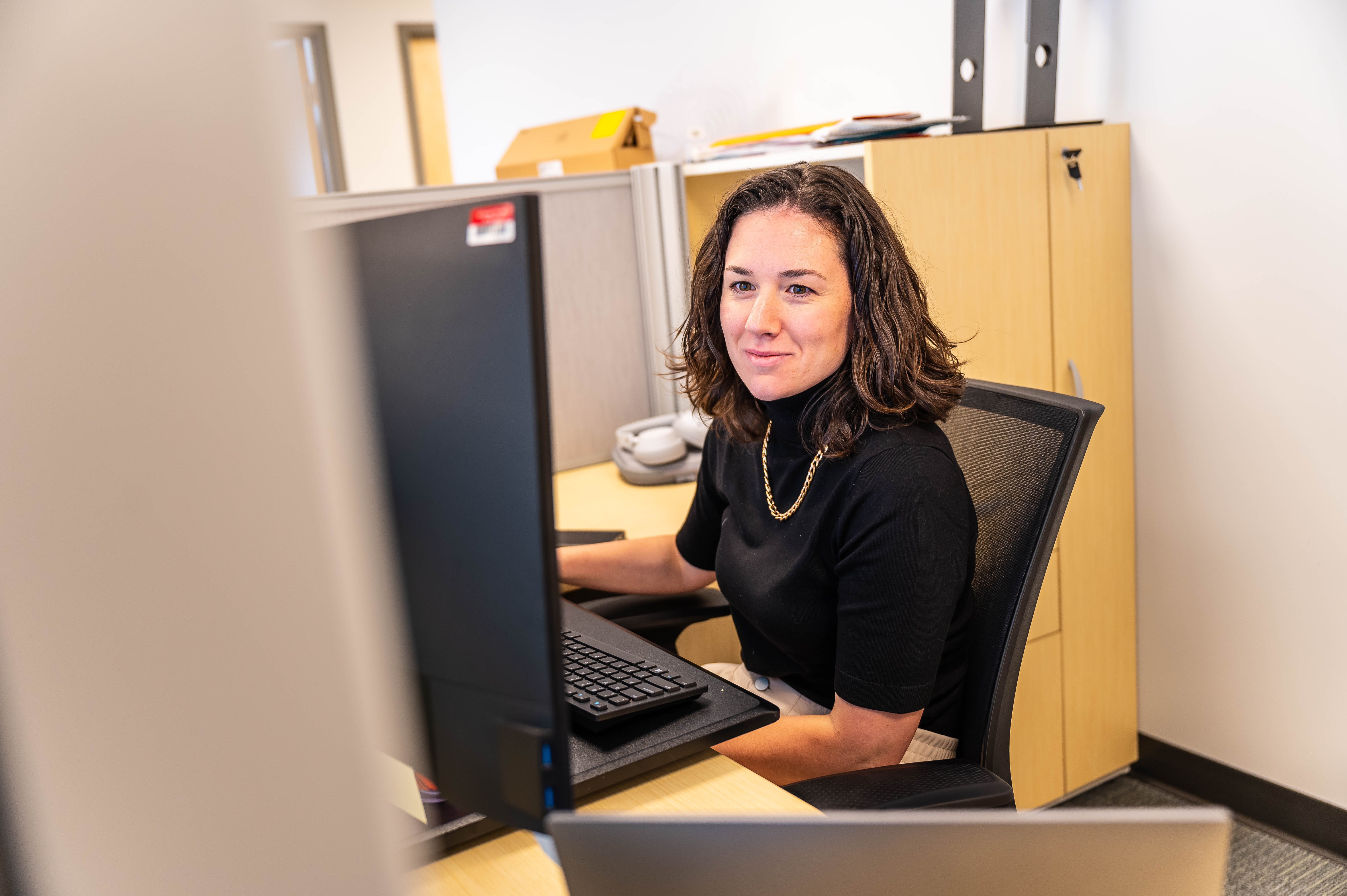 Staff member sitting at a desk