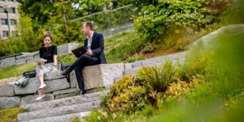 Two people outside having a meeting