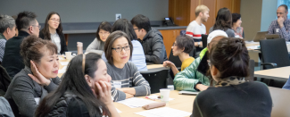 group shot of people attending a workshop and talking