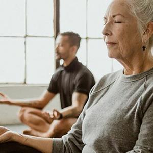 Two people meditating 