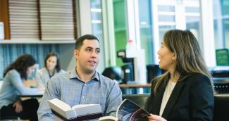 Employees chatting at Allard Hall